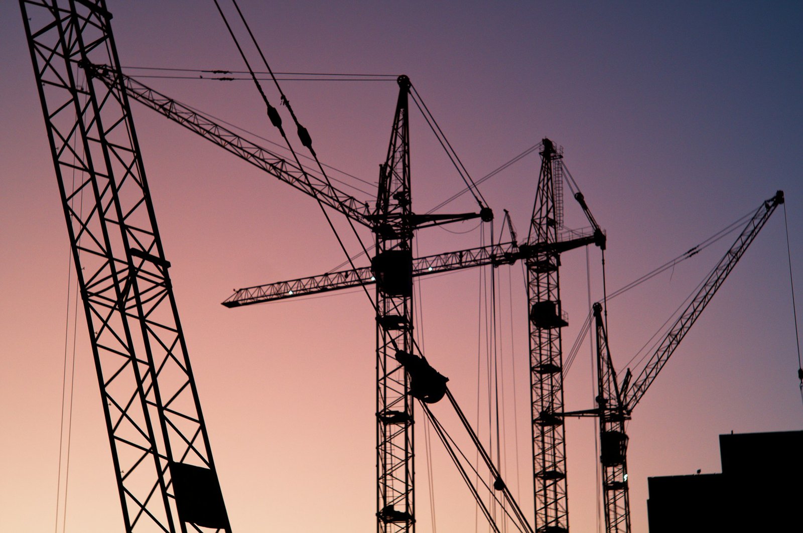 Tower cranes above an active construction site